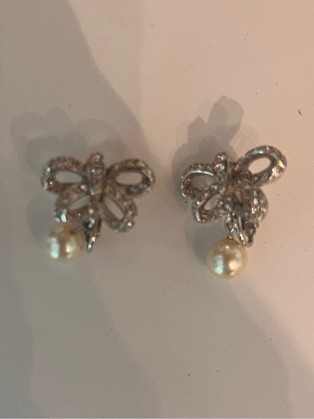 Delicate Silver Bow Pearl Drop Stud Earrings